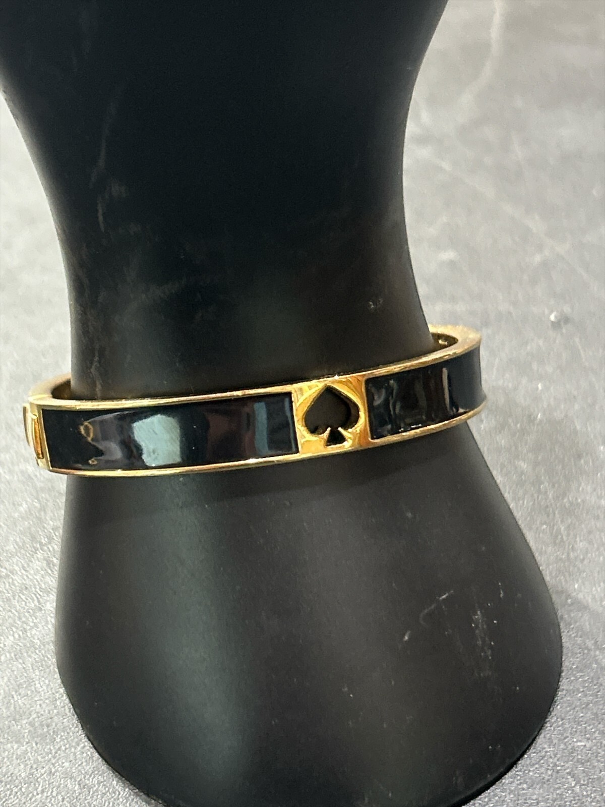 Kate Spade Black and gold Bangle Oval shape