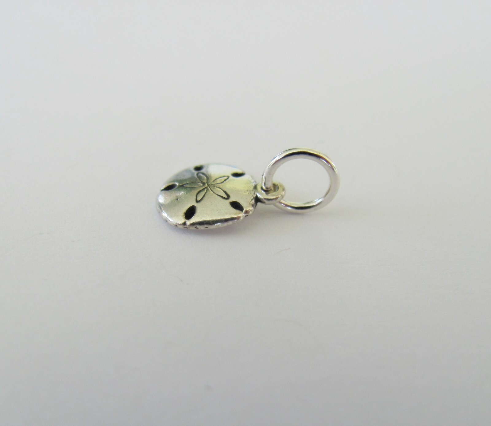 Very small Sterling Silver Sand dollar mini tiny charm.
