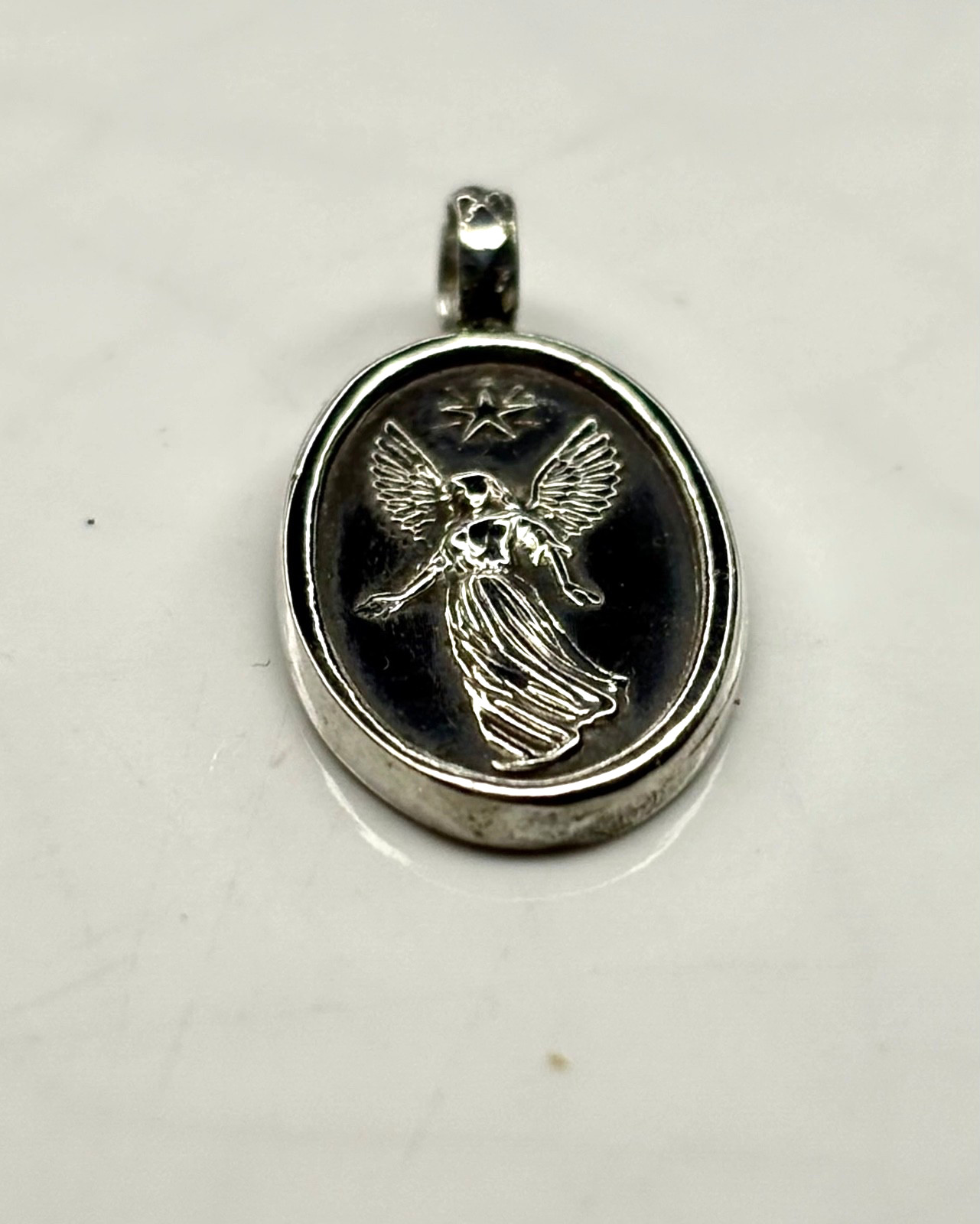 Fine pure Silver 999. guardian angel Minimalist Pendant