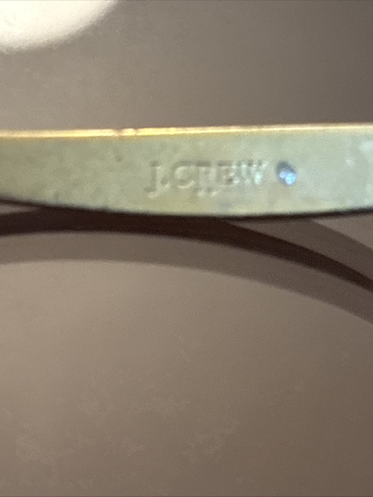 J.Crew gold-tone cuff bracelet two small cubes at the open ends.