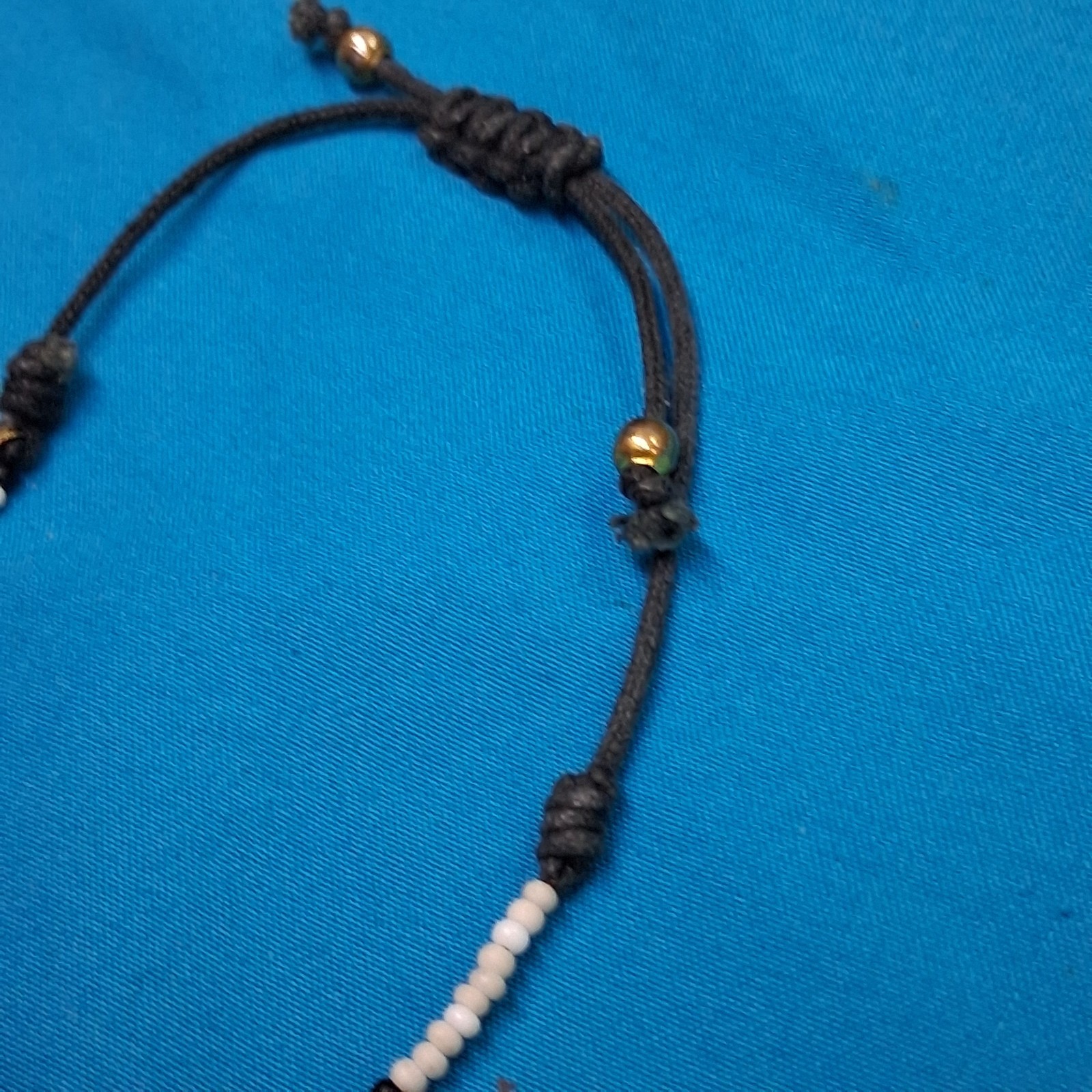 Bead Relief White Channel Set Stone Bead Black Cotton Cord Bangle Bracelet