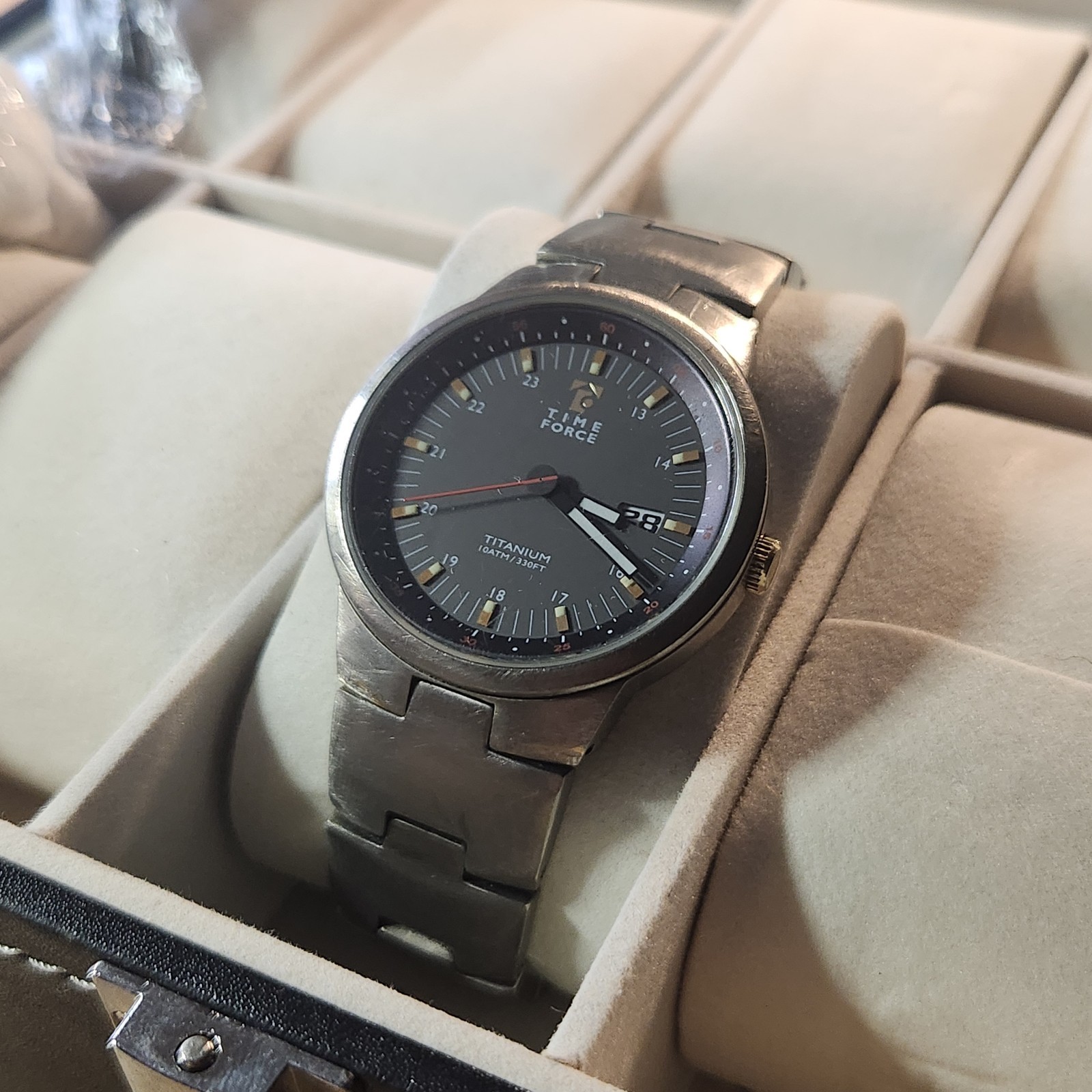 Time Force titanium wristwatch features a 10ATM/330FT water resistance