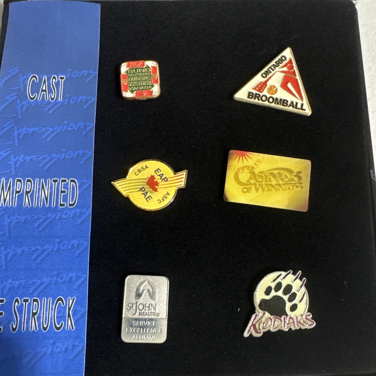 Expressions Emblematic Products Inc. Cast Imprinted Die Struck