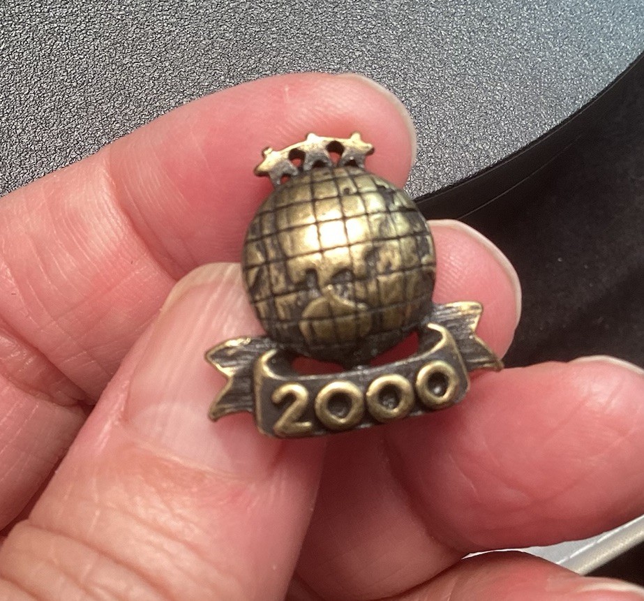 Black And Gold Tone 2000 World Lapel Hat Pin With Stars