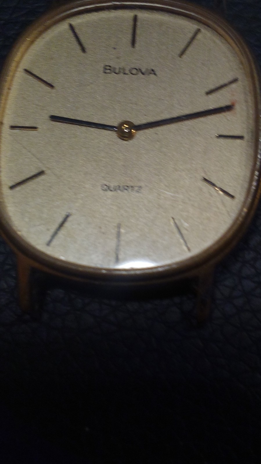 Bulova Quartz Wristwatch Round Gold Case Base Metal Stick Indexes Gold Dial