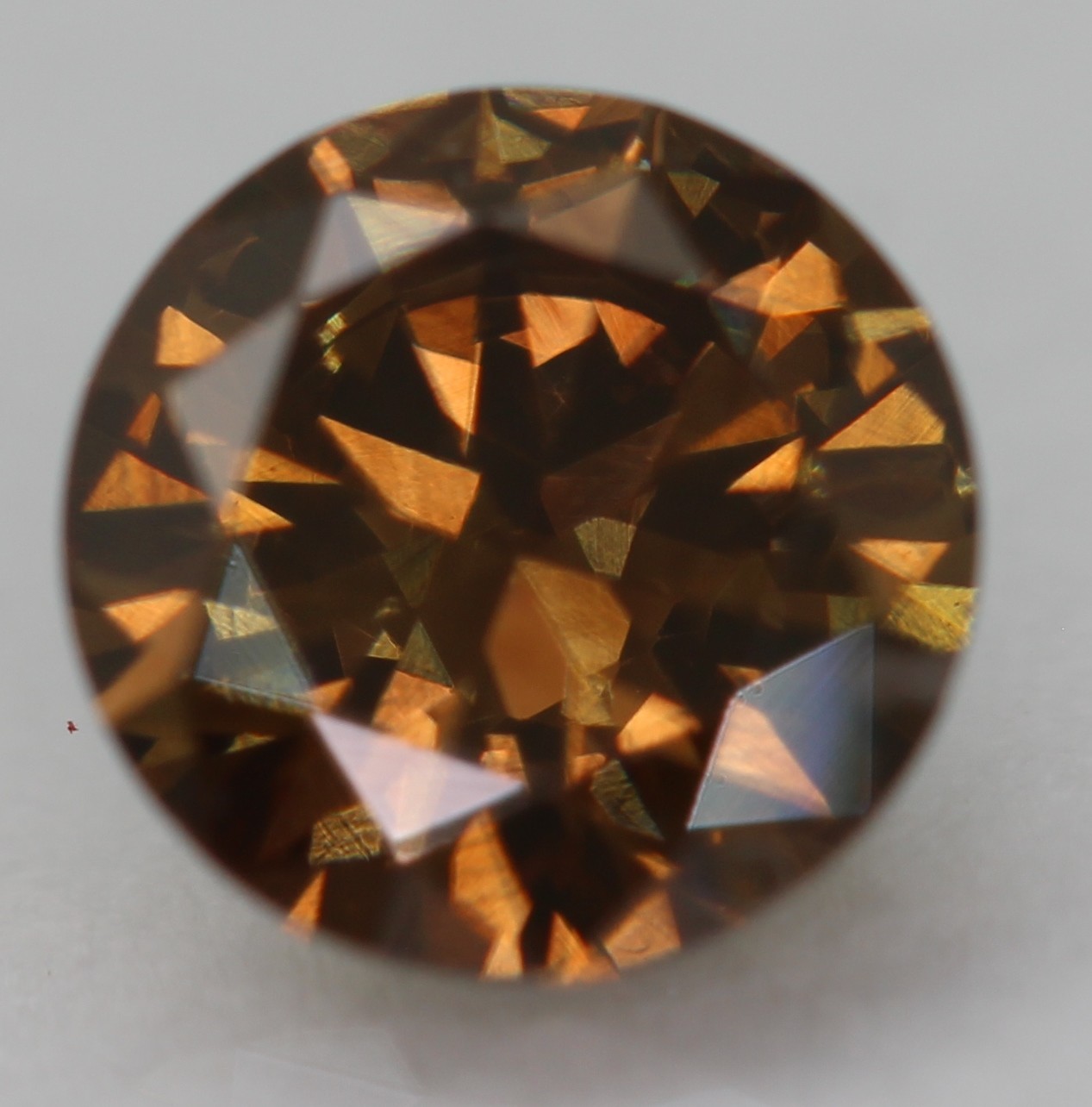 0.52 Carat Orangy Brown VVS2 Round Brilliant Natural Enhanced Diamond 5.4m VIDEO