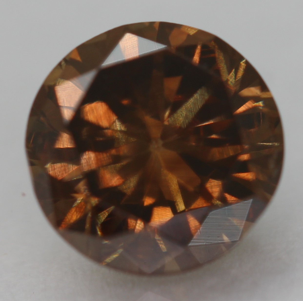 0.63 Ct Orangy Brown VVS2 Round Brilliant Natural Enhanced Diamond 5.38mm VIDEO