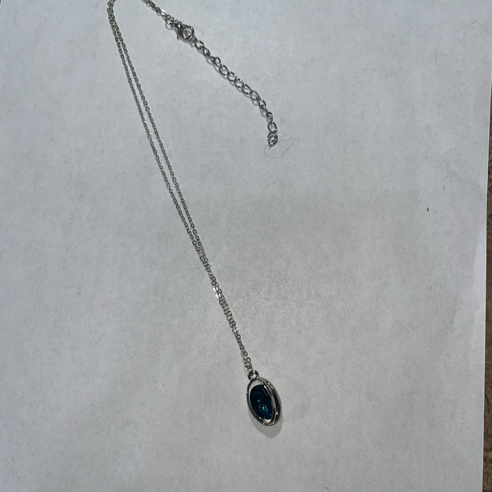 Blue rhinestone necklace in silvertone cage 14″ adjustable
