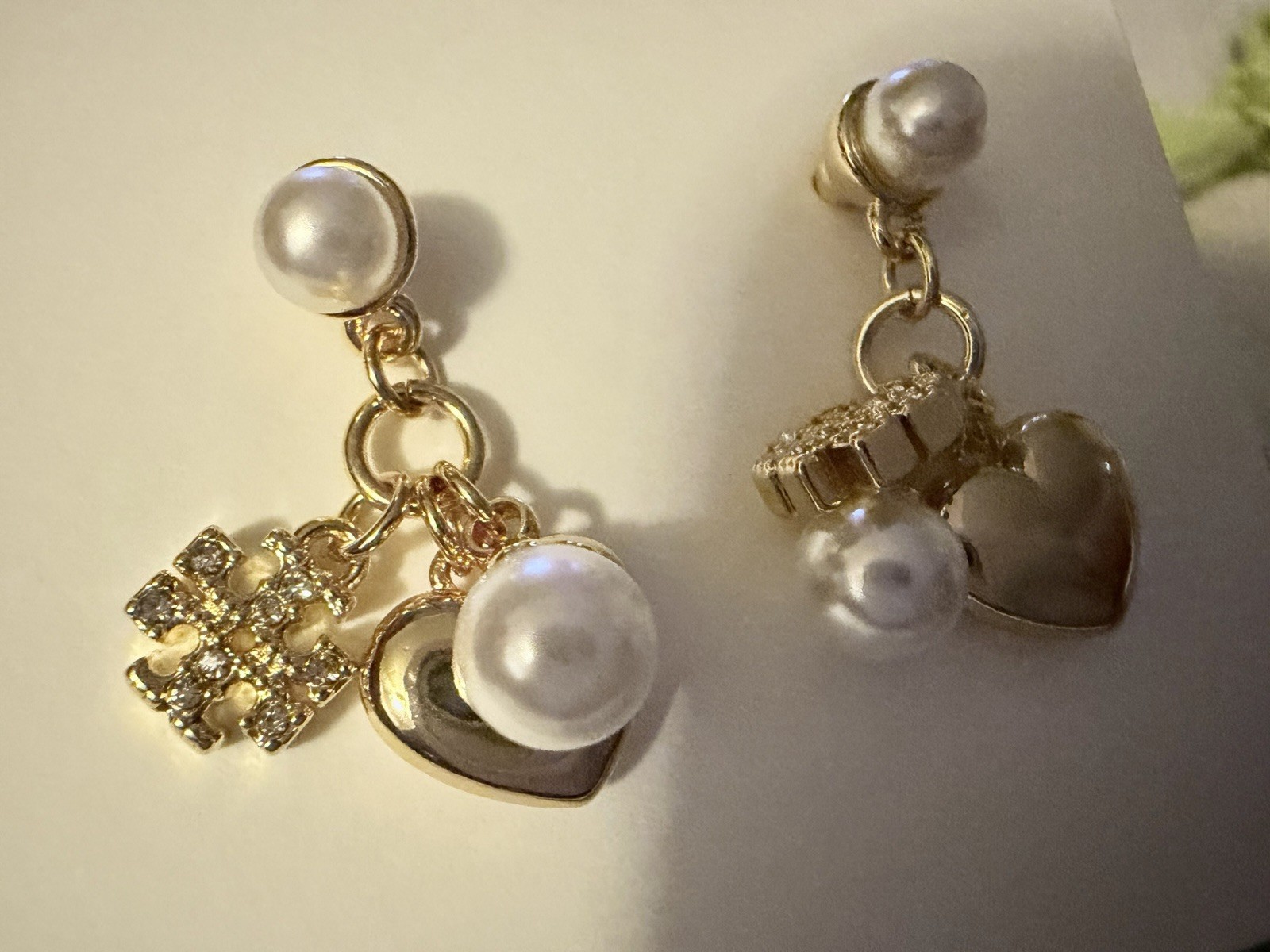 Tory Burch Gold-tone dangling Pearl Heart charms crystal-accented pavé detail