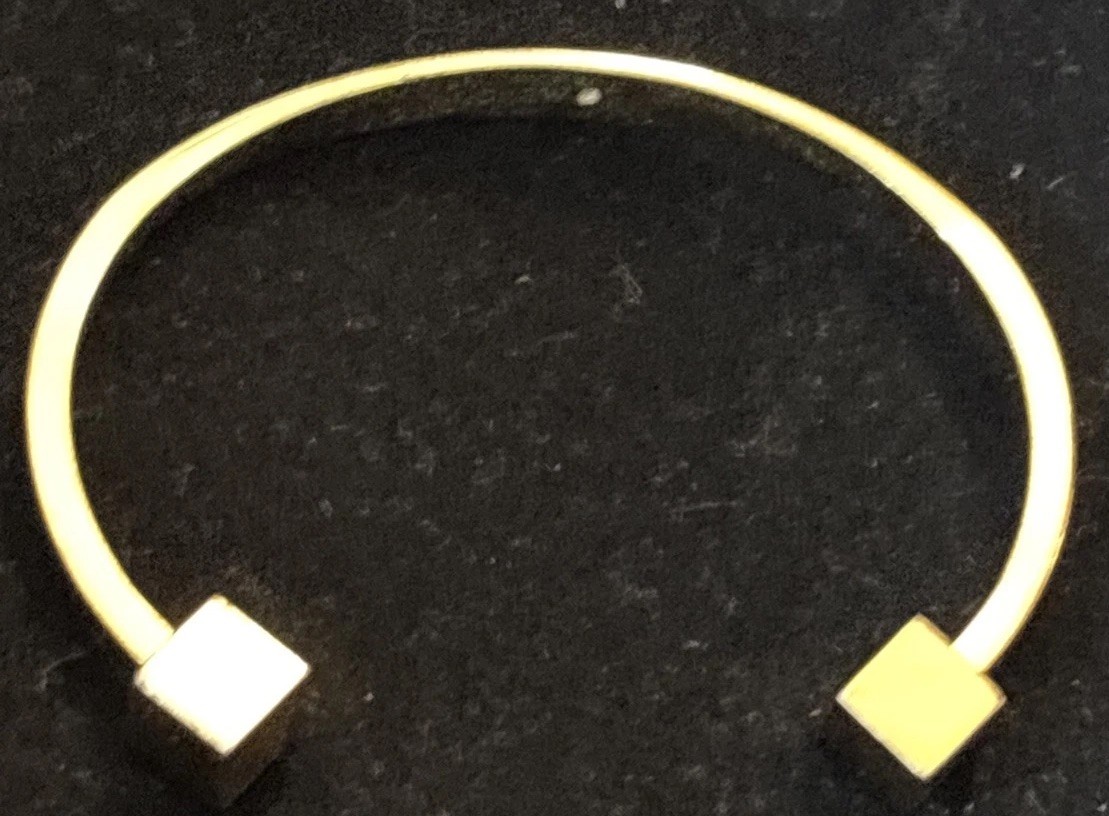 J.Crew gold-tone cuff bracelet two small cubes at the open ends.