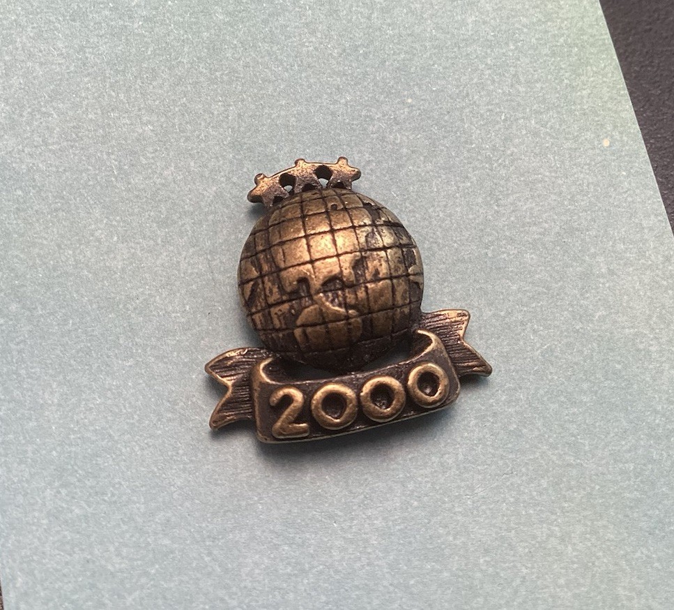 Black And Gold Tone 2000 World Lapel Hat Pin With Stars