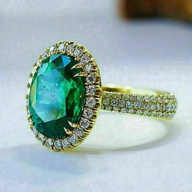 3 Ct Oval Cut Lab-Created Emerald Halo Engagement Ring In 14K Yellow Gold Plated