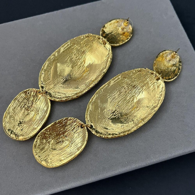 A Pair Brutalist Pierced Dangle Gold Tone Hammered Tribal Runway Earrings