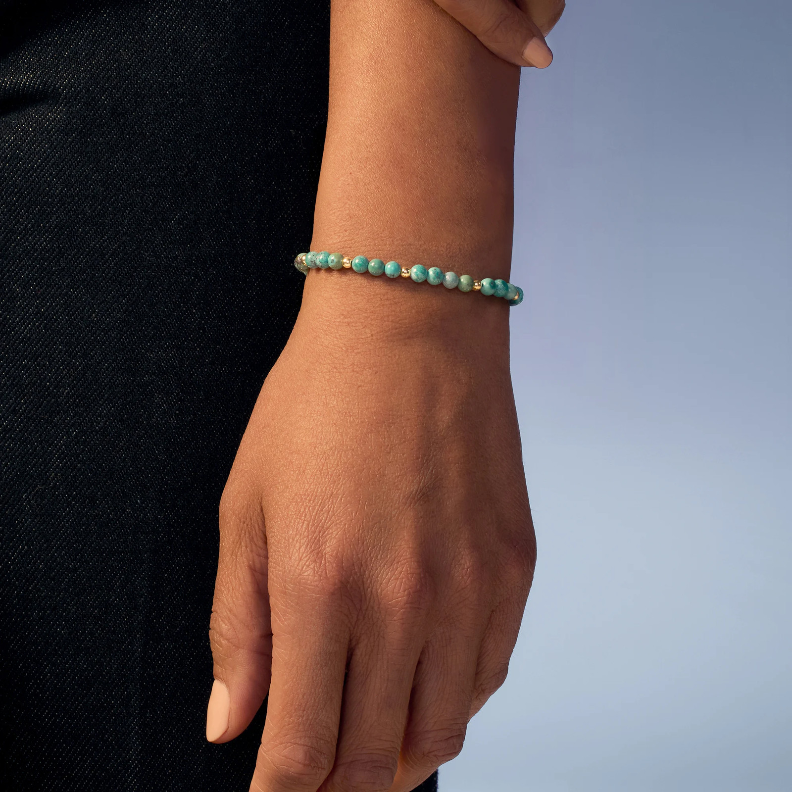 4-4.5mm Turquoise Bead Stretch Bracelet with 14kt Yellow Gold. 7 inches