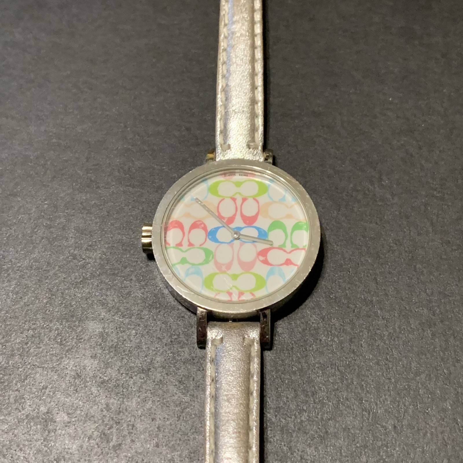 Coach Pastel Signature C watch featuring a white dial with a multicolor logo