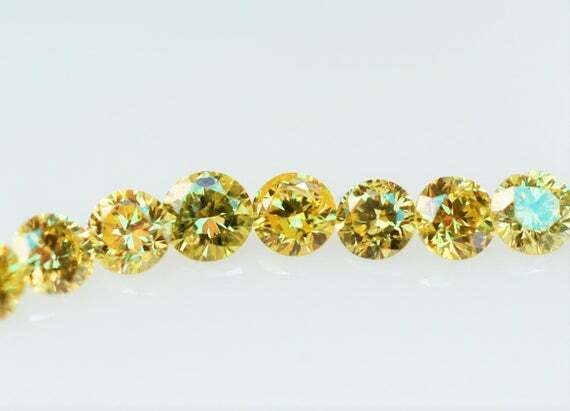 round canary yellow colored diamond .015ct Loose 1.3mm 1.4mm treated individual