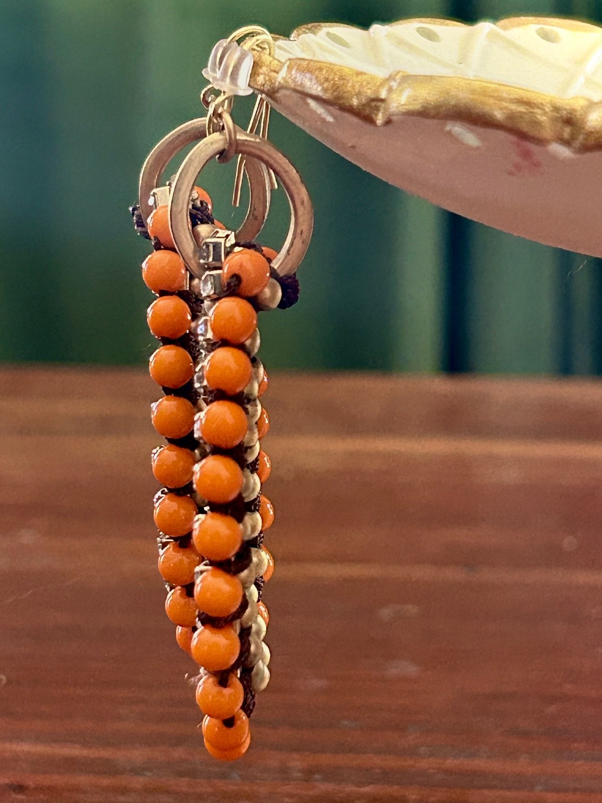 Orange beaded dangle earrings