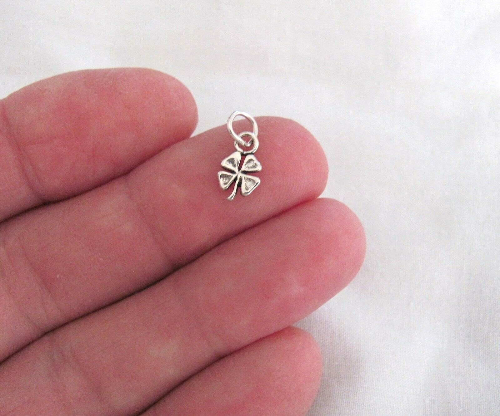 Very small Sterling Silver antiqued look lucky 4 leaf clover mini tiny charm.