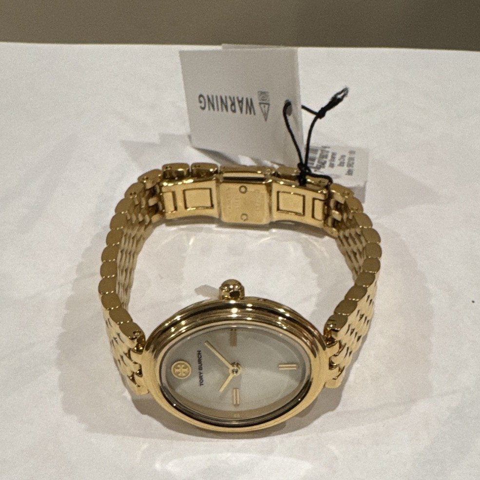 Tory Burch Women’s Quartz Dress Watch Oval White Dial Gold Tone Bracelet 30m