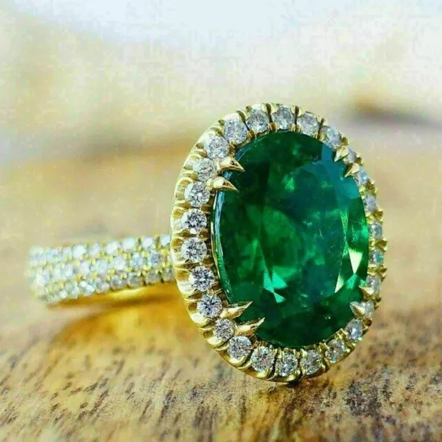 3 Ct Oval Cut Lab-Created Emerald Halo Engagement Ring In 14K Yellow Gold Plated