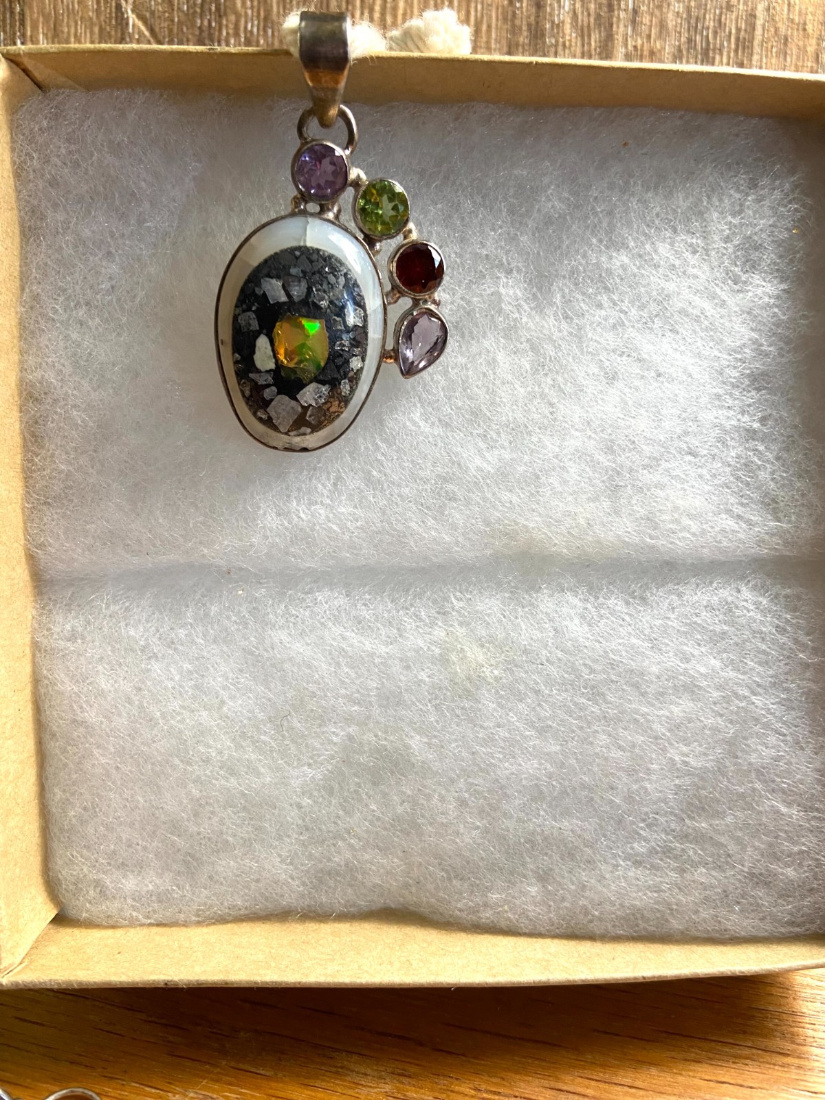 Ethiopian Opal Pendant with Amethyst, Ruby and Peridot accent stones.