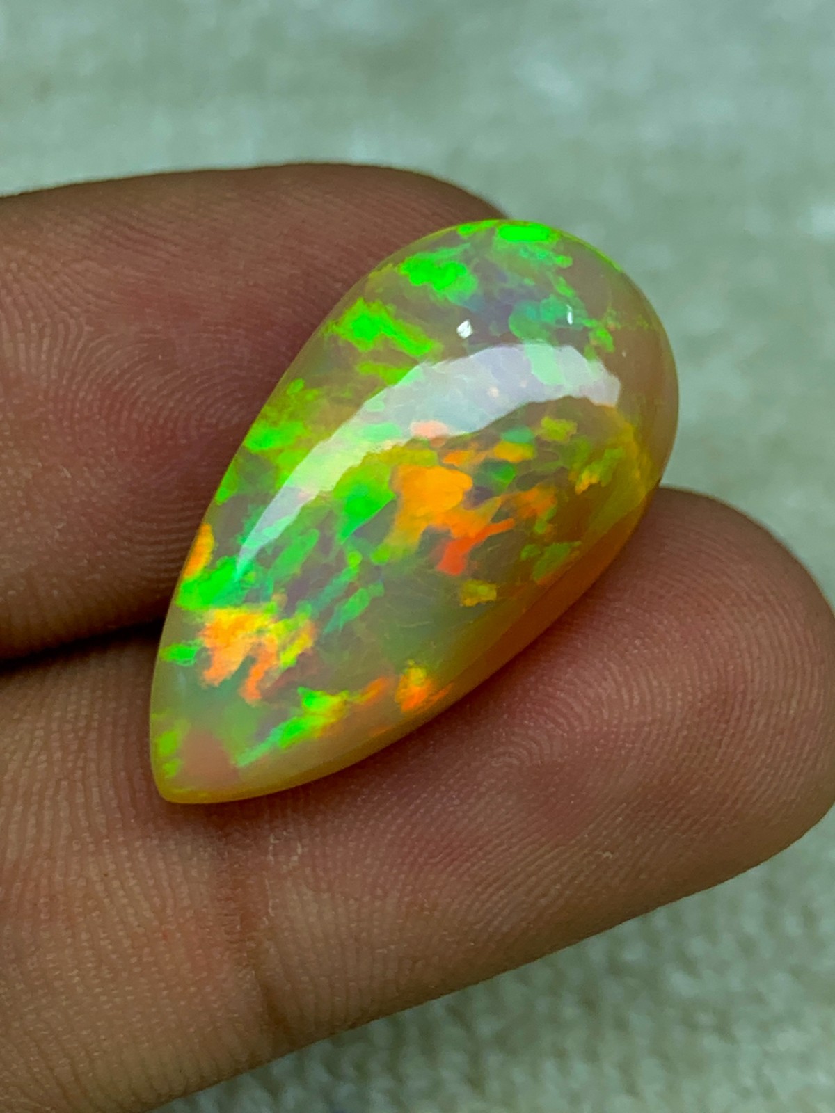 Natural Ethiopian Opal Honeycomb Pattern 14.90 Carat Multi-Fire Pear Cabochon