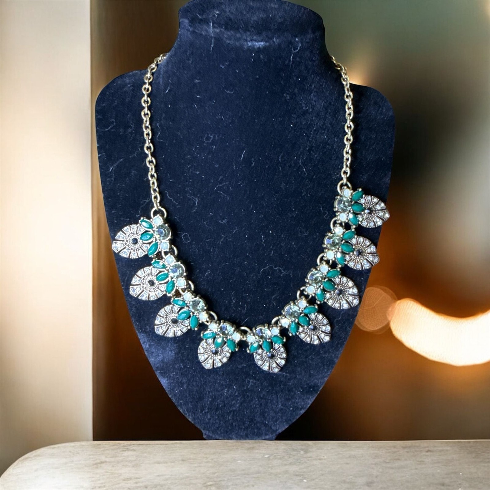 Stella & Ruby Gold Tone Statement Necklace with Green and Iridescent Faux Stones