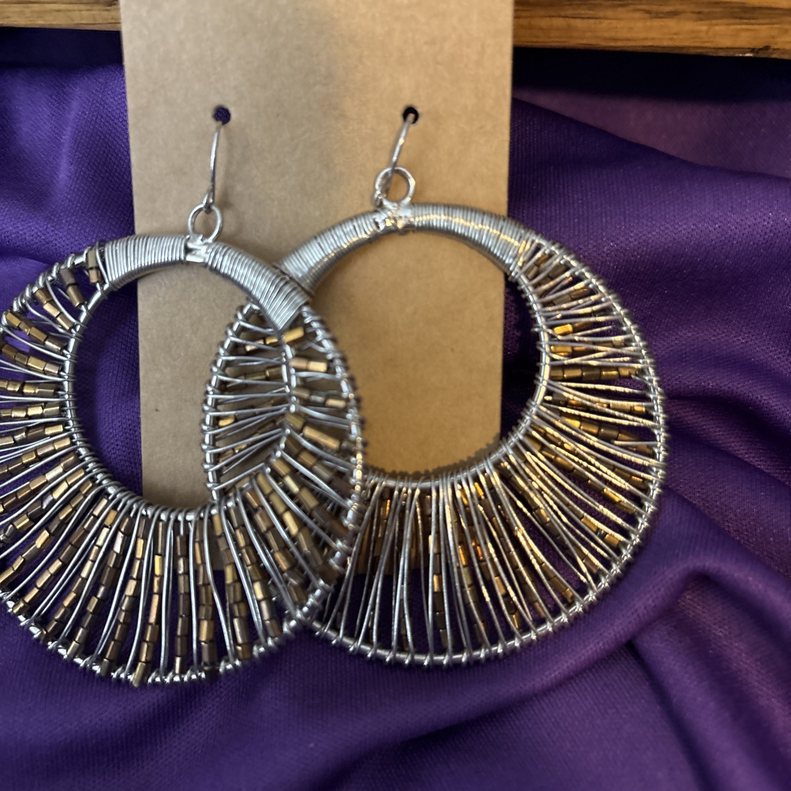 large silver wire wrapped hoop earrings w/ pewter beads.