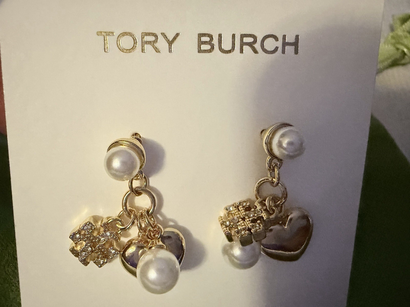 Tory Burch Gold-tone dangling Pearl Heart charms crystal-accented pavé detail
