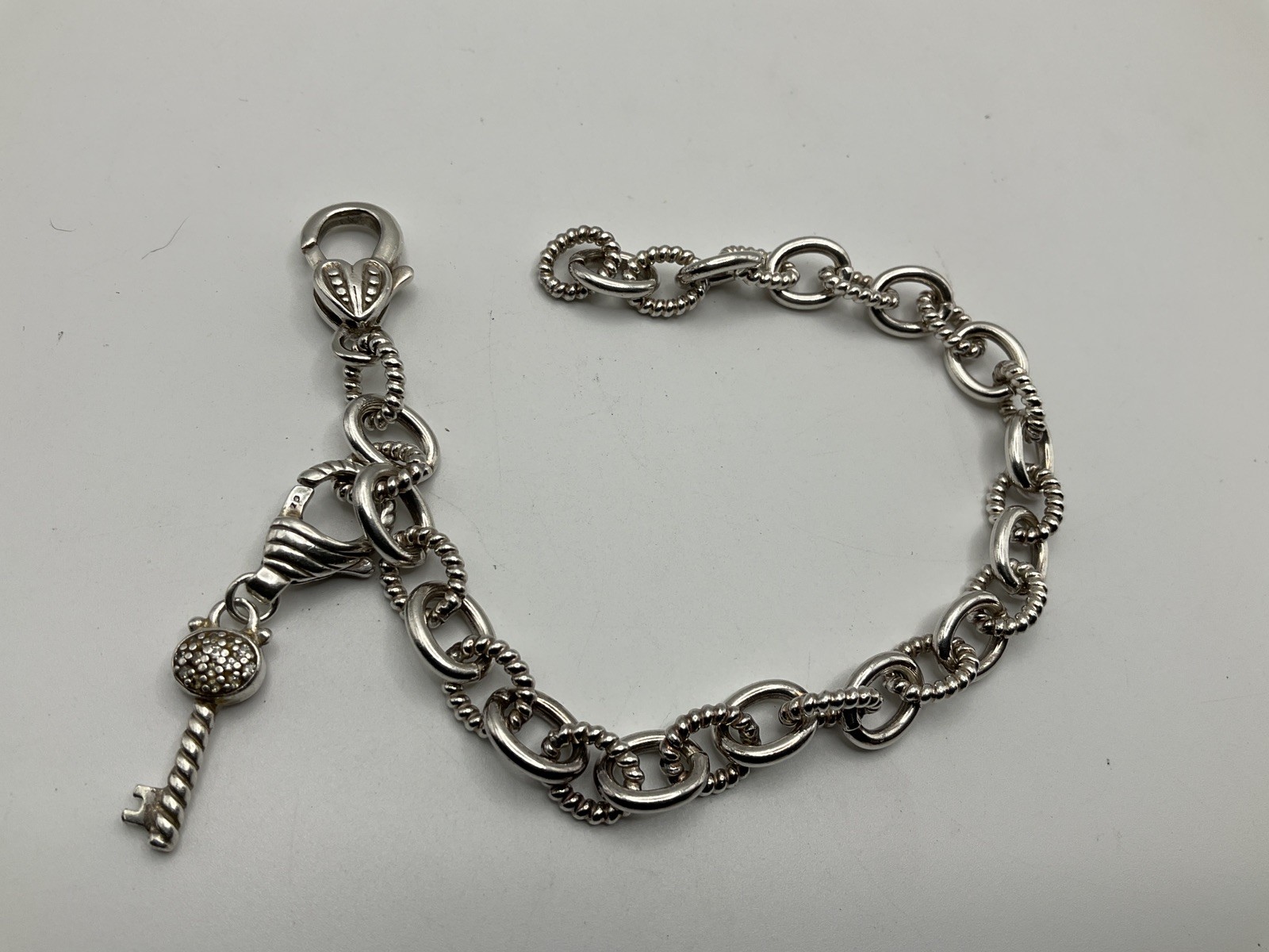 JUDITH RIPKA Sterling Silver link chain with key charm Bracelet 8.5”