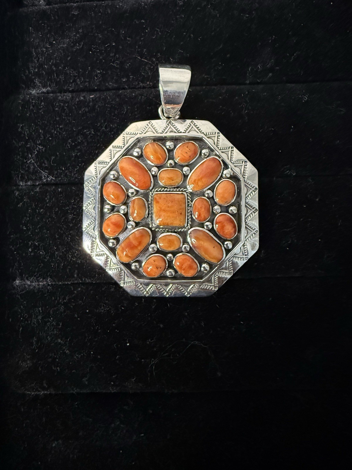 Handcrafted authentic Kenneth Jones Navajo orange spiny cluster pendant