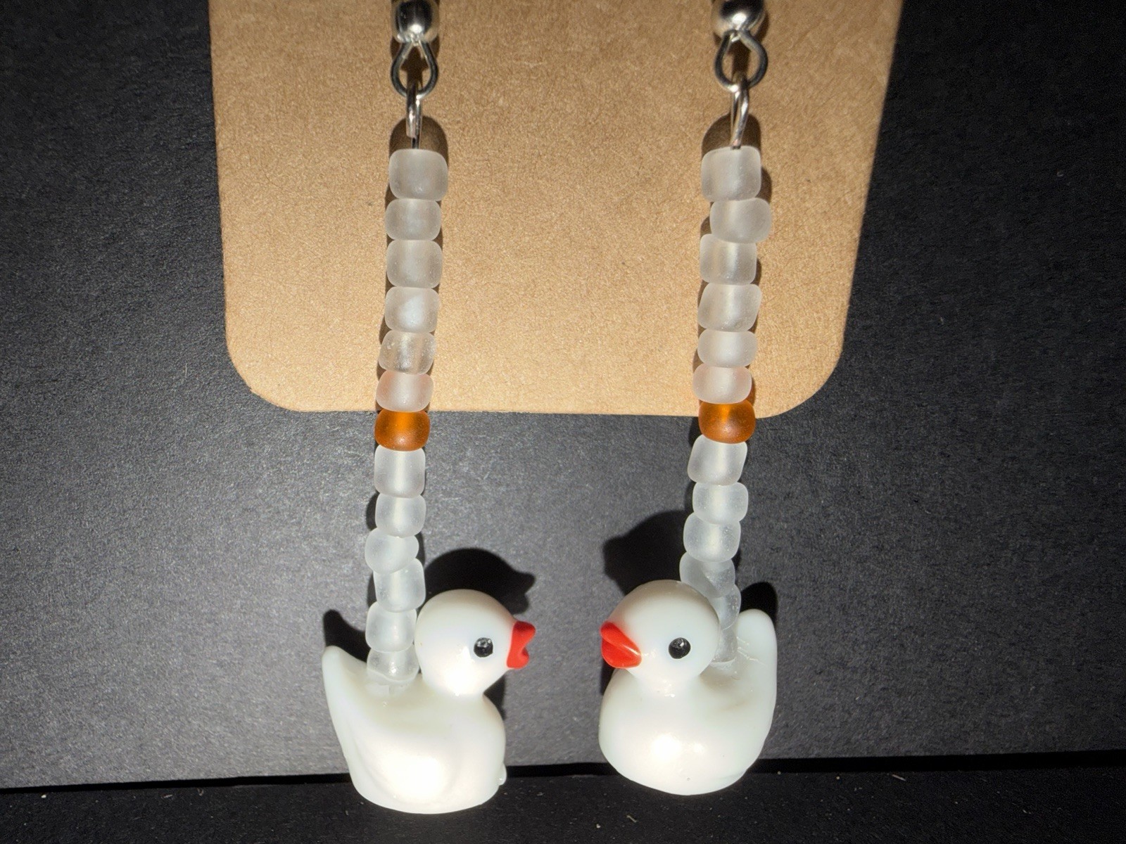 Handmade ooak white dangle drop duck earrings with frosted glass bead details
