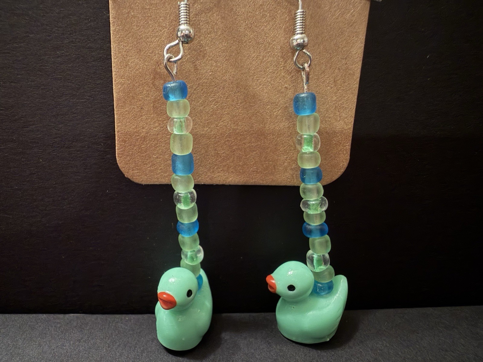 Handcrafted ooak mint duck dangle drop earrings with green and blue glass