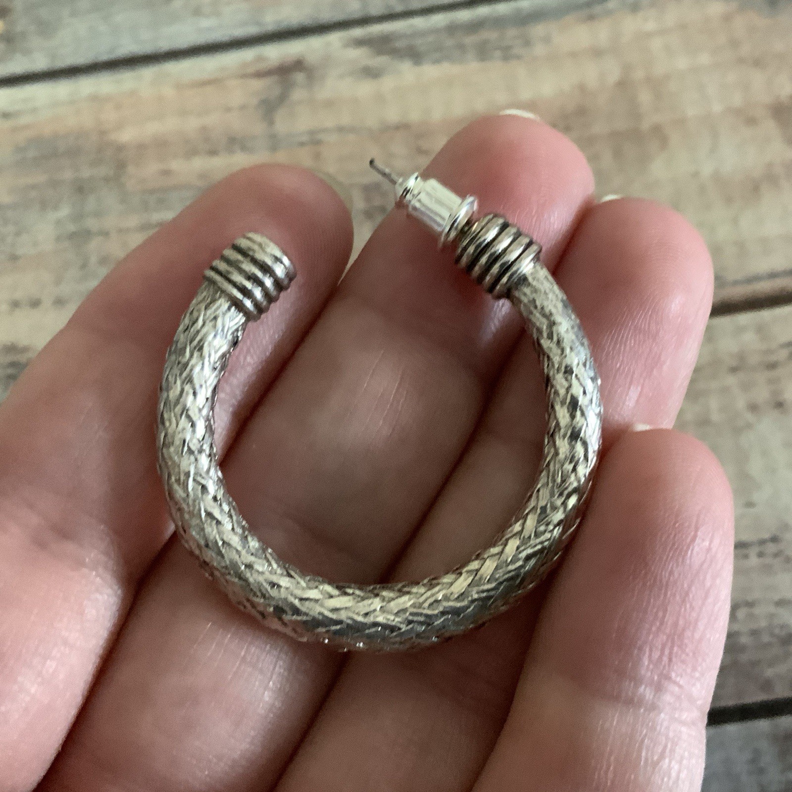Pierced silver tone braided mesh wire hoop earrings