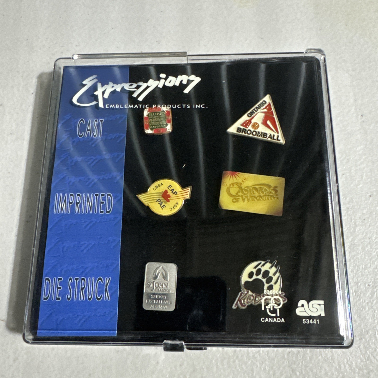 Expressions Emblematic Products Inc. Cast Imprinted Die Struck