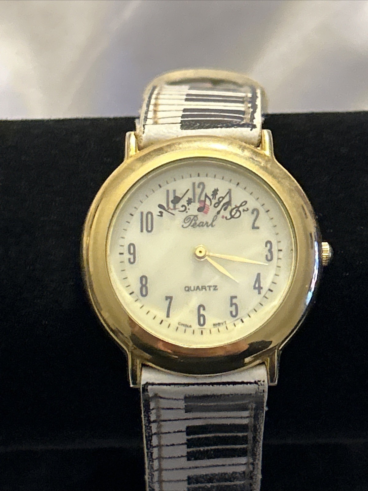 Vintage Pearl Music Watch 35mm Gold Tone Ticking Notes Piano Strap
