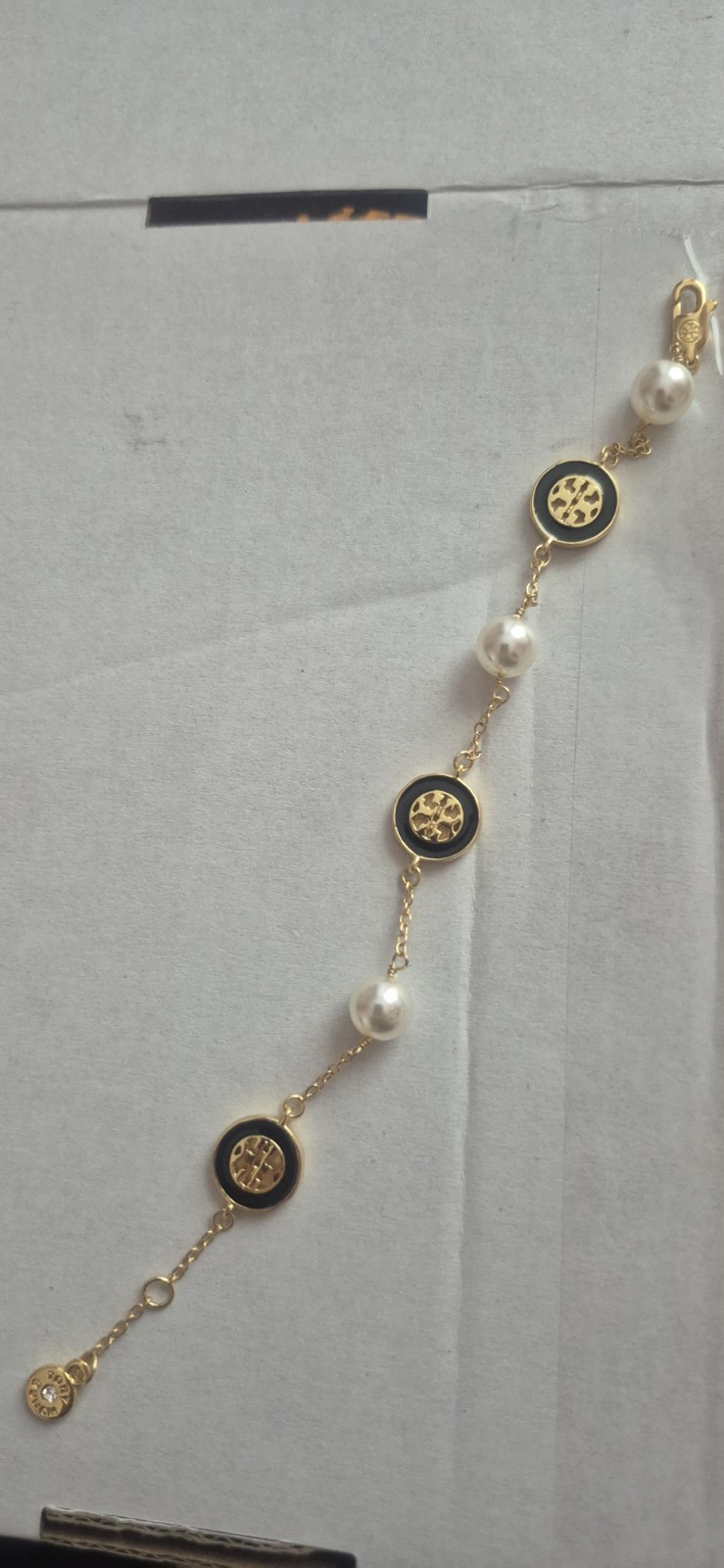 Tory Burch Kira pearl-chain bracelet features a delicate gold-tone chain