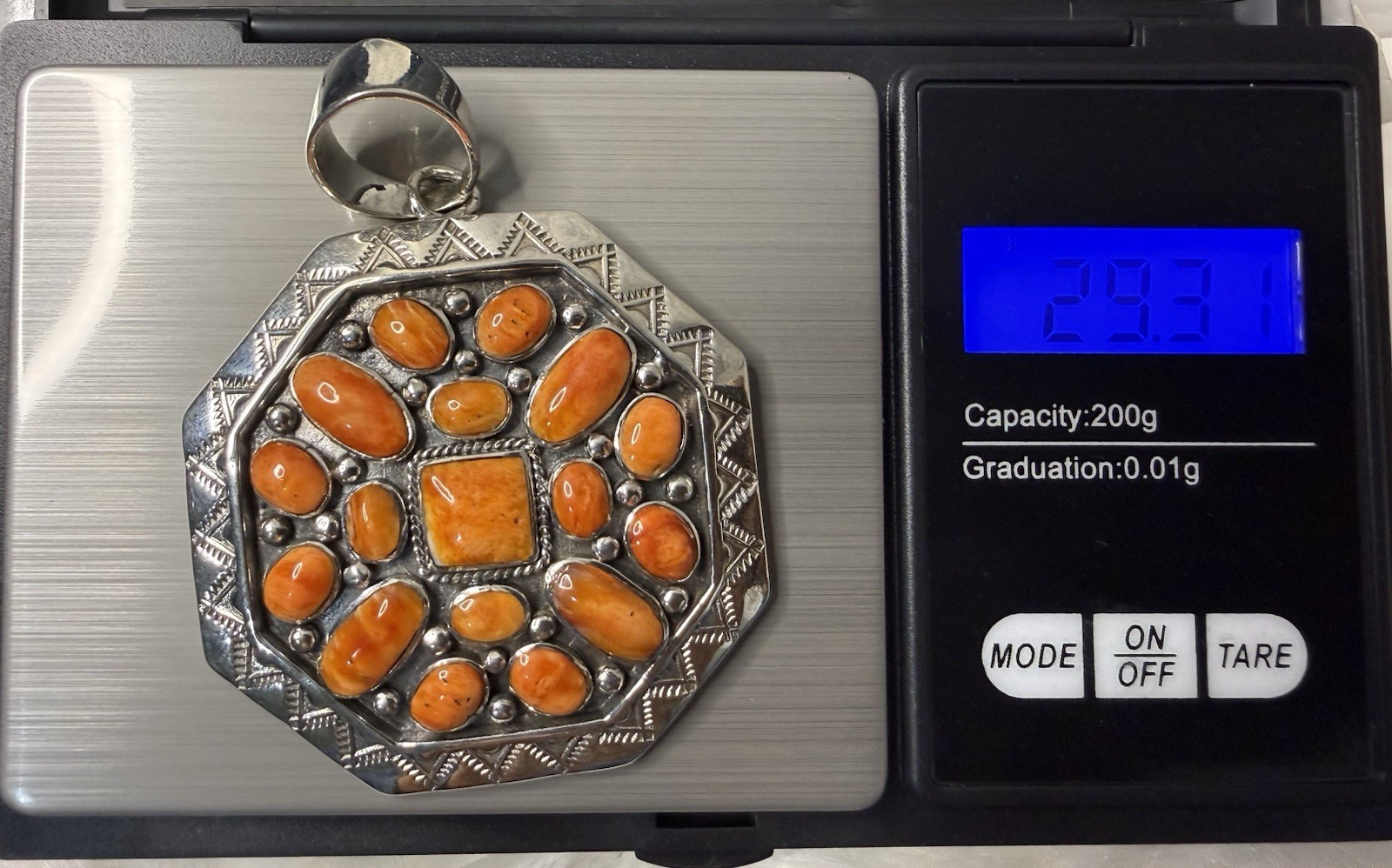 Handcrafted authentic Kenneth Jones Navajo orange spiny cluster pendant