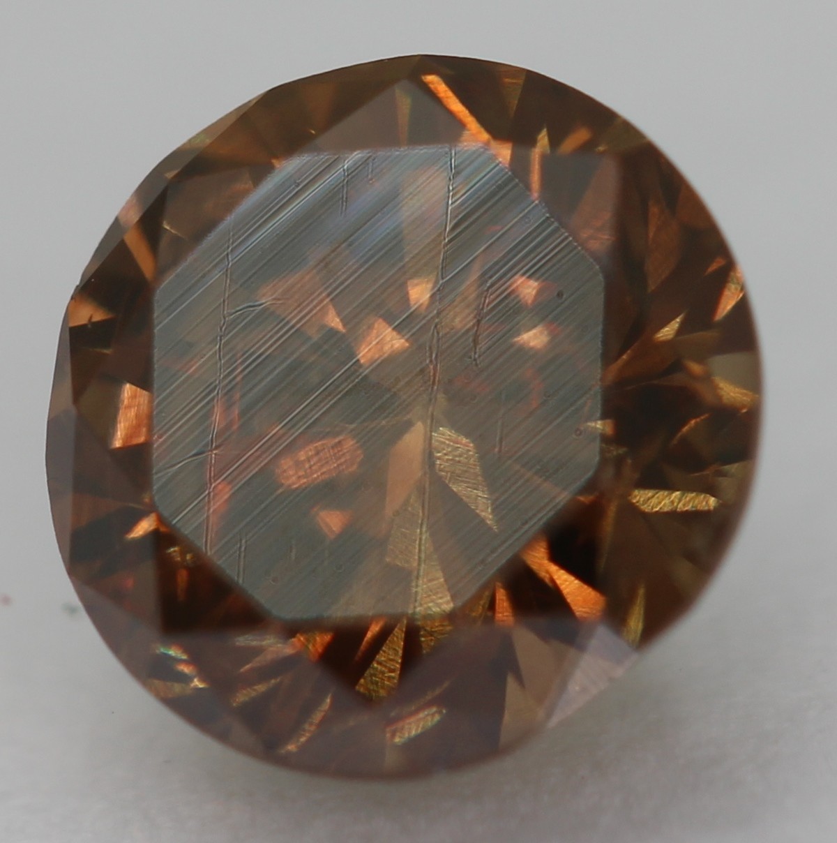 0.63 Ct Orangy Brown VVS2 Round Brilliant Natural Enhanced Diamond 5.38mm VIDEO