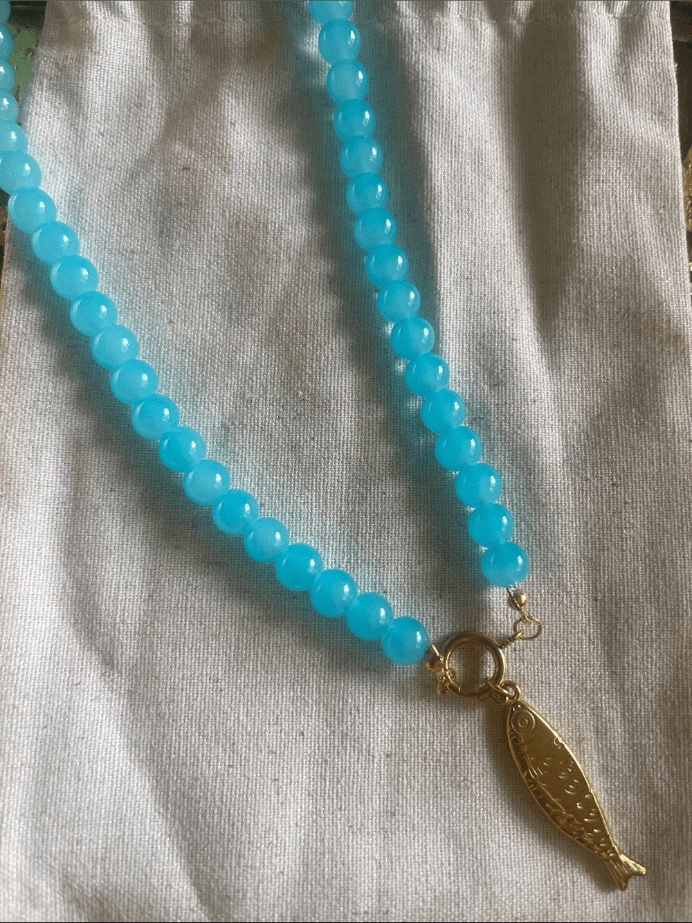 Turquoise Blue Beaded Necklace with Gold Fish Pendant