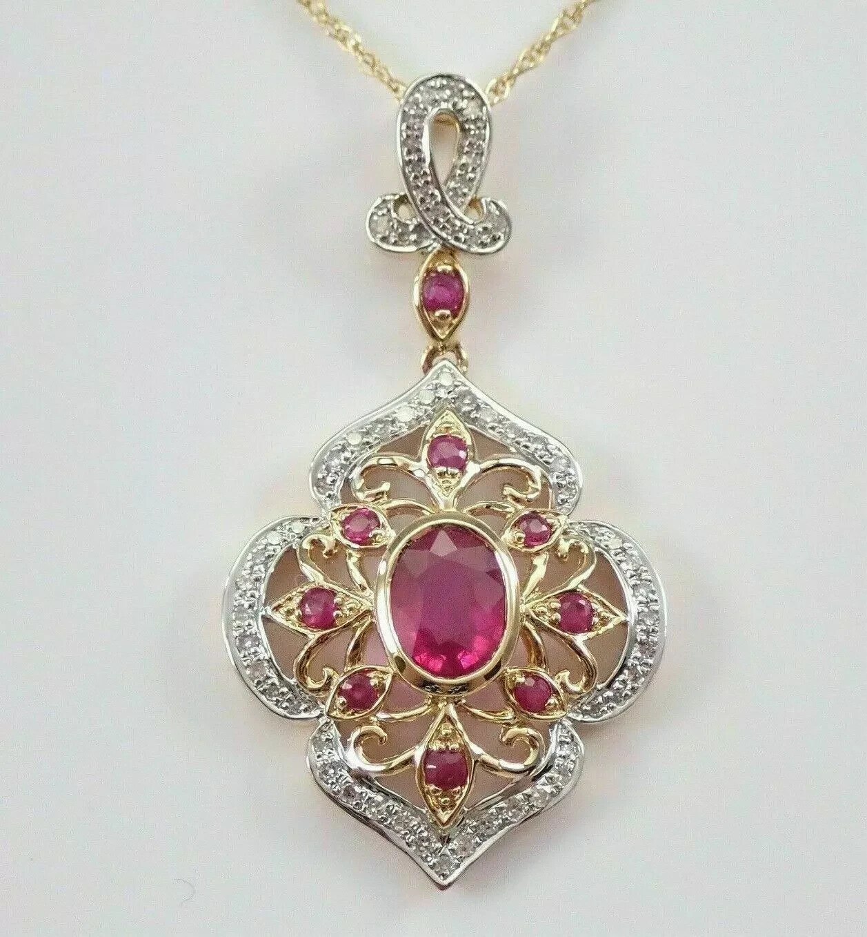 2Ct Ruby Lab Created Oval Cut Pendant 14K Yellow/White Gold Over Free Chain