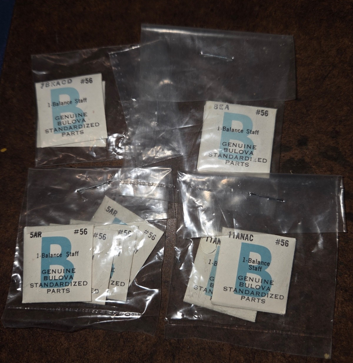 Twenty (20) Bulova balance staffs, sealed , NOS. See calibres in description.