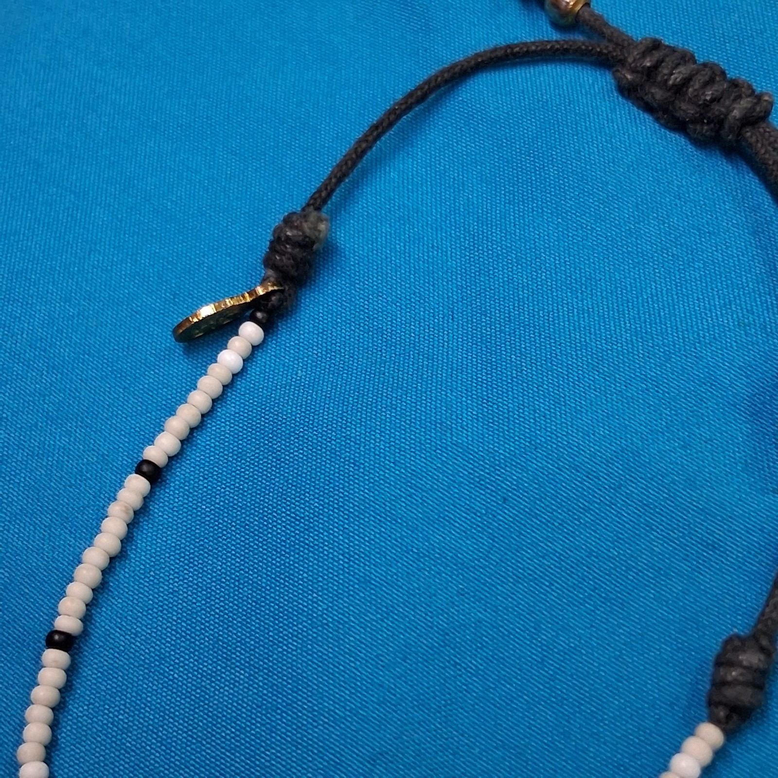 Bead Relief White Channel Set Stone Bead Black Cotton Cord Bangle Bracelet