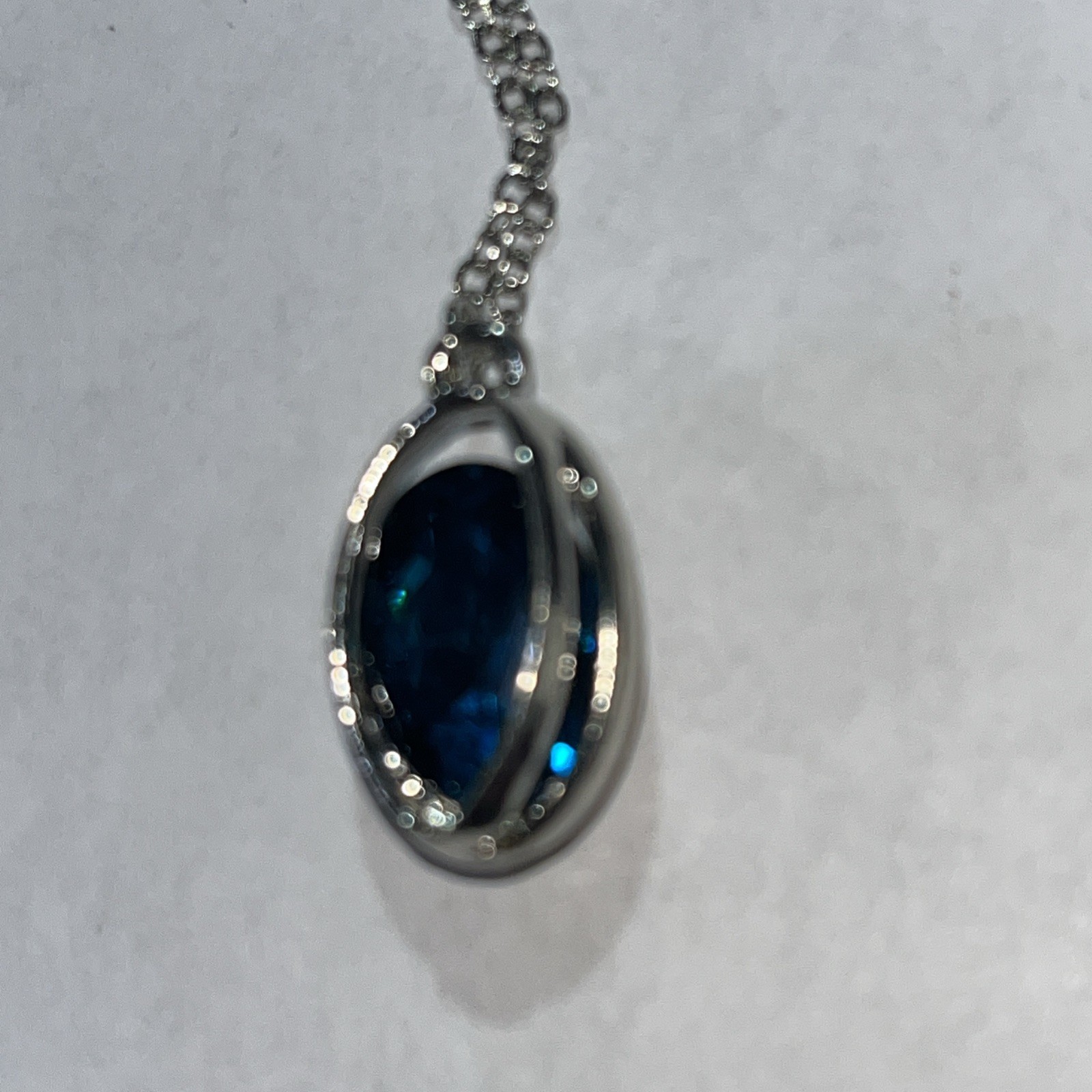 Blue rhinestone necklace in silvertone cage 14″ adjustable