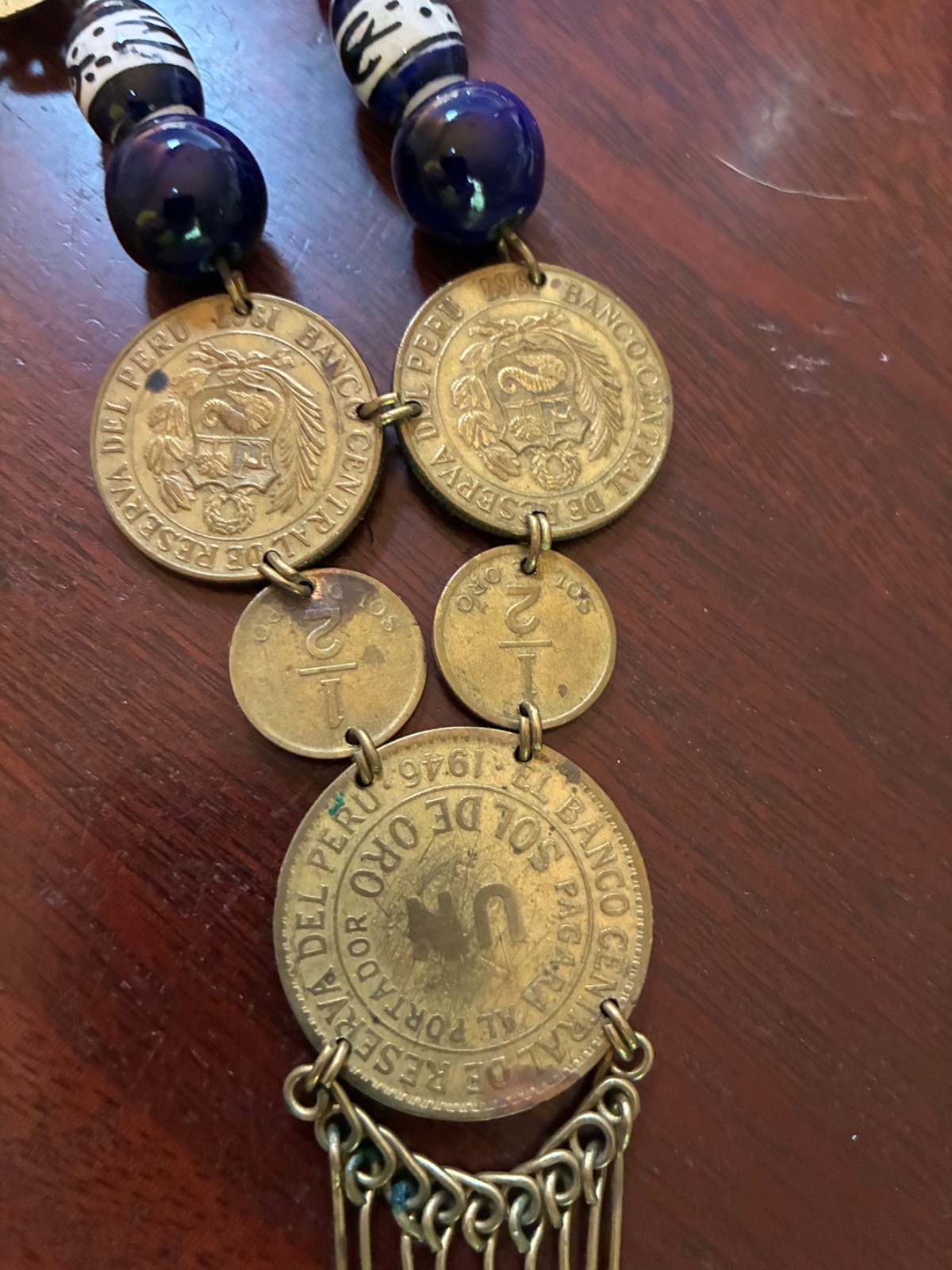 Peruvian necklace with 1946 and 1961 un sol de oro