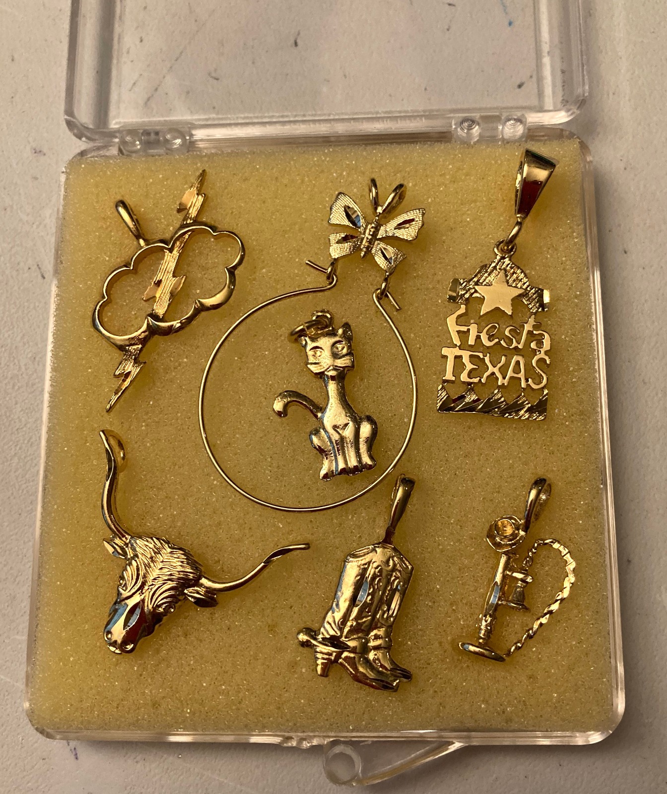 SIX (6) GOLD TONE CHARMS WITH HANGER