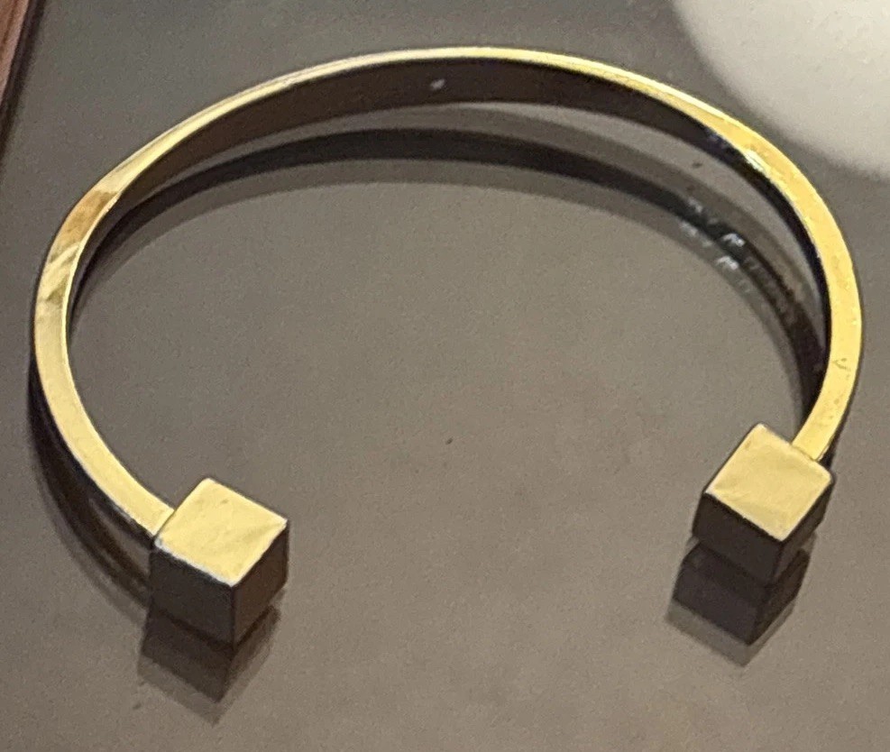J.Crew gold-tone cuff bracelet two small cubes at the open ends.