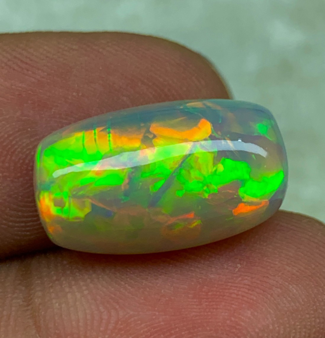Rare Natural Semi-Black Ethiopian Opal 7.10 Carat Multi Fire Cushion Cabochon