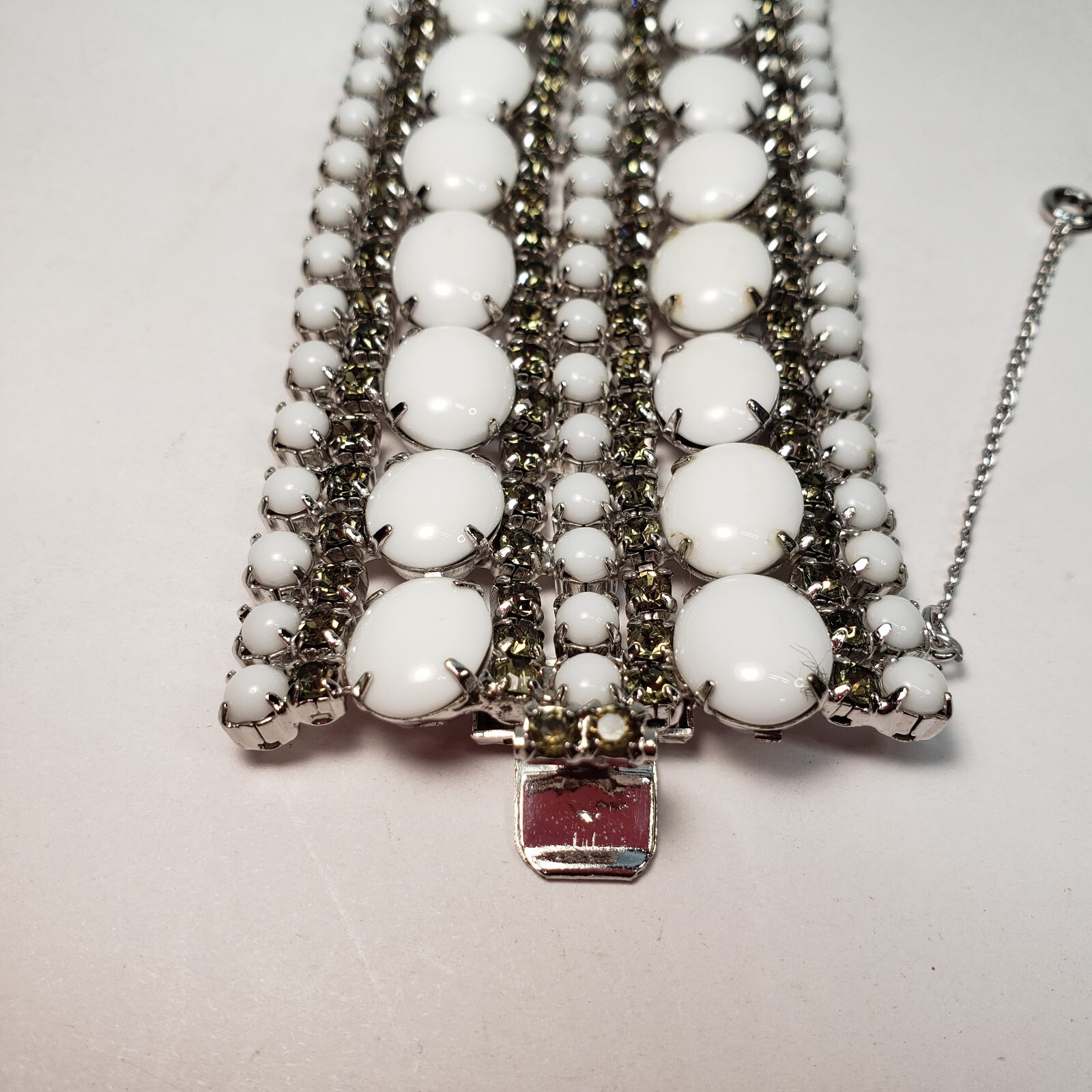 Milk Glass Bracelet With Crystal Rhinestones, 9 Rows. 7in Long 2in Wide