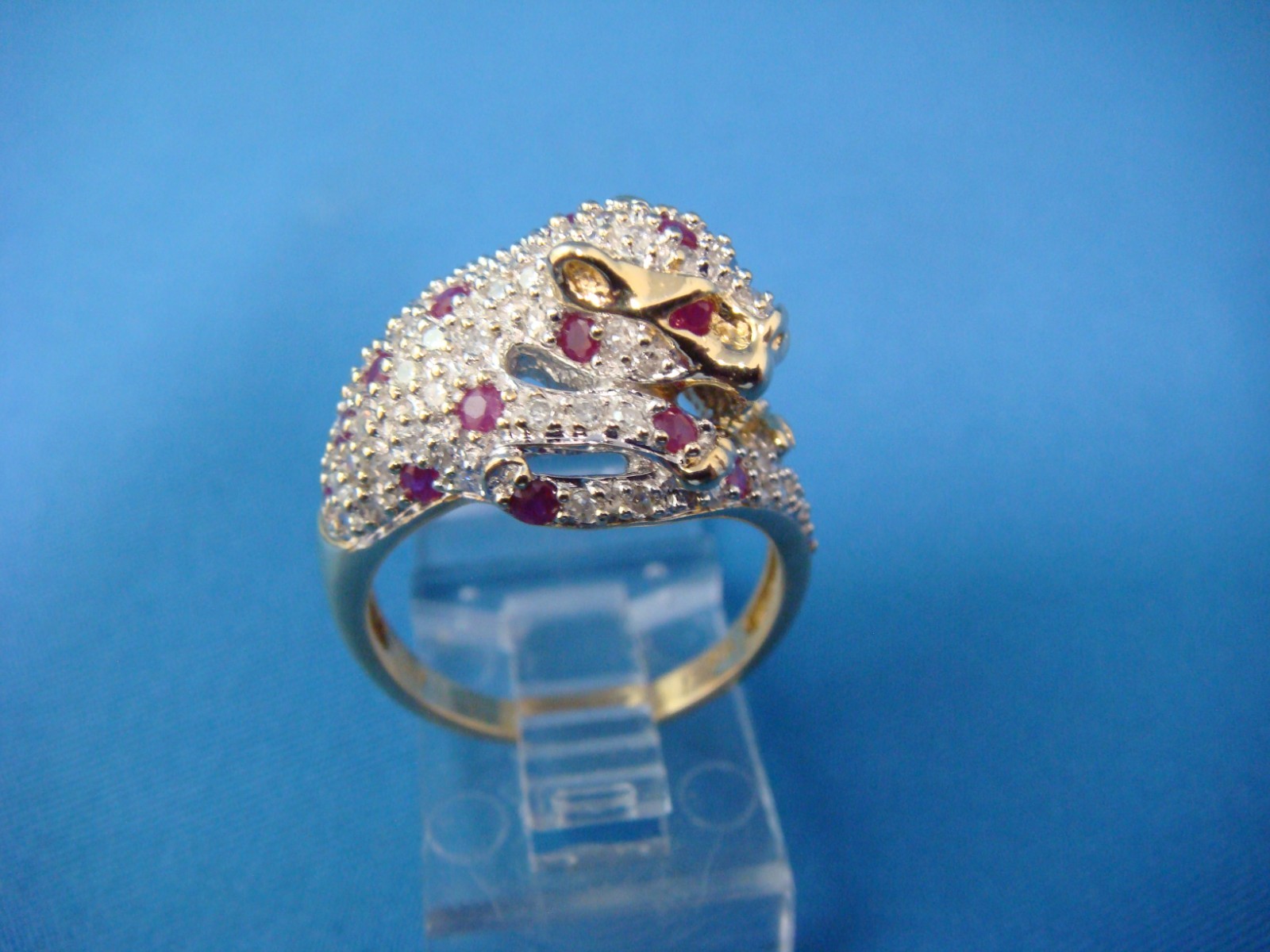 10 KT PANTER LADIES RING WITH GENUINE RUBIES AND DIAMONDS 5.3 GRAM,S SIZE 7